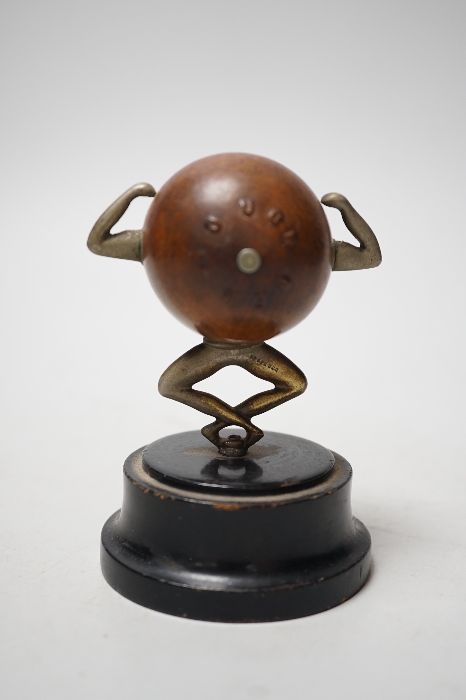 An early 20th century 'Touch Wud' figure, on an ebonised plinth 11cm tall